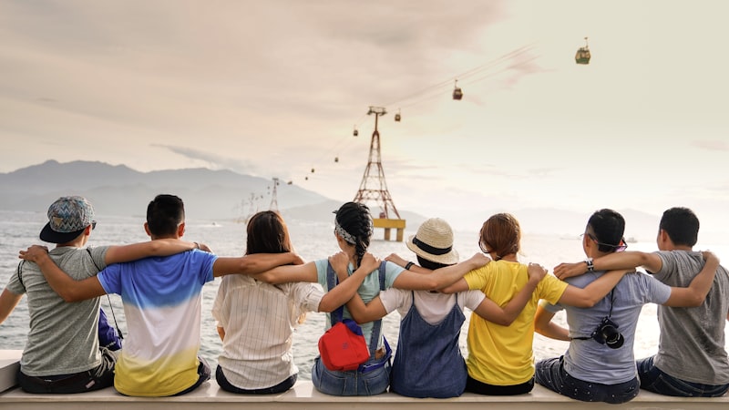 Group of diverse people laughing together outdoors